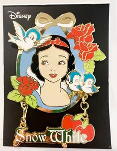 snow white keychain with roses and an apple on the front, disney pin