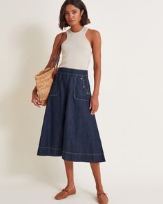 Monsoon Harper A-Line Denim Midi SkirtSeasonal? Couldn't be this skirt. Falling to midi length, this skirt flares into an A-line cut with tobacco stitching. Style it through summer with a cami and sandals, and winter with knee high boots and a jumper. Finished with pockets.machine washOuter: BCI Cotton 100% Summer Holiday Outfits, Denim Collection, Denim Midi Skirt, Socks And Tights, Top Beauty Products, Cotton Skirt, Baby Clothes Shops, A Line Skirt, Feminine Style