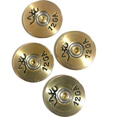 three brass buttons with numbers and symbols on them