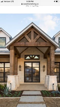 the front entrance to a home with stone steps leading up to it's entry