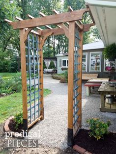 an outdoor area with a wooden arbor and benches