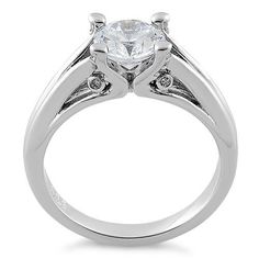 Top of ring height: 7.2mm

Top of ring width: 8mm

Band width: 3.2mm

Shank width: 2.8mm



Stone material: clear cubic zirconia

Center stone size: 7mm

Stone shape: round cut 

Center stone carat weight: 1.28ct

Total number of CZ stones: 1

Stone setting: prong setting



Metal: 925 sterling silver

Plating: rhodium plated

Finish: high polish Stone Material, Stone Setting, Cz Ring, Cz Stone, Stone Settings, Rhodium Plated, Prong Setting, Round Cut, Cubic Zirconia