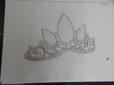 a drawing of a tiara on a piece of paper