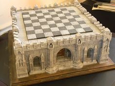 a chess board on top of a wooden table