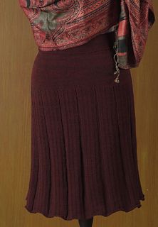 a woman's skirt and scarf on display