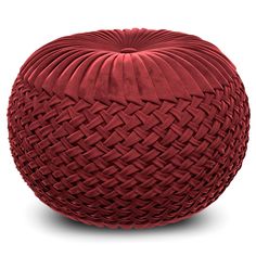 a large red cushion sitting on top of a white floor