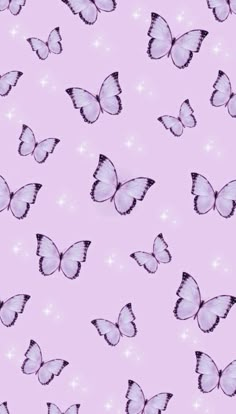 a pink background with lots of butterflies on it