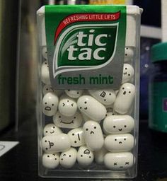 a container filled with lots of white balls