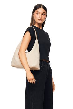 The Renee Sand by Nakedvice is a suede sand handbag. Featuring a leather strap with branded silver studs, panel detailing and a metal stud closure. The Renee Sand is the perfect suede shoulder bag for the girl on the go. Colour: SAND Chic Suede Hobo Bag, Chic Suede Hobo Bag With Removable Pouch, Everyday Neutral Leather Hobo Bag, Neutral Leather Hobo Bag For Everyday, Everyday Suede Hobo Bag, Versatile Everyday Shoulder Bag With Silver-tone Hardware, Chic Suede Bags With Soft Leather, Chic Suede Hobo Bag For Everyday, Beige Leather Shoulder Bag With Silver-tone Hardware