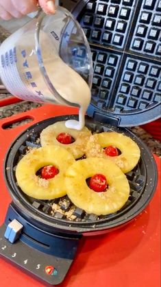 someone is pouring milk on some pineapples in a waffle iron and they are ready to be cooked