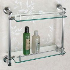 two glass shelves with soap and lotion on them