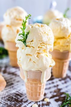 three ice cream cones are sitting on a table with the words passion fruit ice cream