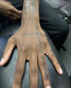 a person with a tattoo on their hand