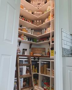 an open pantry door with shelves full of food