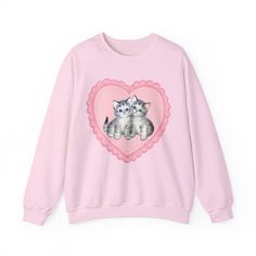 Cute sweetheart kitties! Front design on a half cotton half polyester, cosy lined sweater.  .: 50% cotton, 50% polyester .: Medium-heavy fabric .: Ribbed knit collar, to retain shape after washing .: Loose fit .: Sewn-in label .: Runs true to size FREE SHIPPING within the UK! Please check out sizing before purchase, because the item will be made to order so I cannot accept returns.                                             S         M        L        XL        2XL        3XL        4XL Cute Cat Heart, Cat Heart, Pastel Outfit, Retro Valentines, Sweatshirt Cute, Cat Shirt, Heart Shirt, Cat Shirts, Dream Clothes