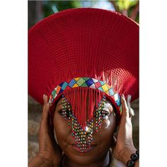 This elegant Zulu Basket Hat in red with beading is the perfect accessory to upgrade any outfit. This piece is handmade by female artisans in South Africa. The hat is made out of woven grass, polyester cloth patterned with cotton, wool threads, and decorative glass beads. It can be worn on special occasions like birthdays, weddings, and formal gatherings. As with all handmade items, no two pieces are the same. PRODUCT DESCRIPTION: 15" W × 7" H Head Size: 24" Also comes in: Black & White - He