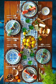 an overhead view of a table set with plates and bowls