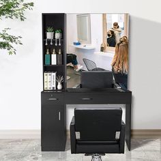 a woman is getting her hair done in front of a mirror and she is sitting at a desk