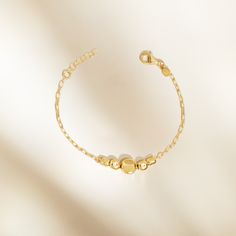 Stunning yet understated, the Mare Graduated Nuggets Bracelet perfectly captures the essence of the summer collection. The hammered nuggets are delicately handstrung along a paperclip bracelet and convenient extender allows for the right fit with your bracelet stacks. Product Details:Made from 14kt gold plated .925 sterling silverMeasures approximately 6.25" long plus 0.75" extenderLobster LockGraduated Nuggets Adjustable BraceletAL230095VMade in Italy Adjustable Gold Bracelet With Satellite Chain, Dainty Hammered Adjustable Bracelets, Adjustable Dainty Paperclip Bracelet, Minimalist Adjustable Paperclip Bracelet With Extender, Paperclip Bracelet, Bracelet Stacks, Nugget Bracelet, Luxury Jewelry Brands, Italian Jewelry