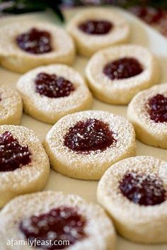 cookies with jam are arranged on a baking sheet