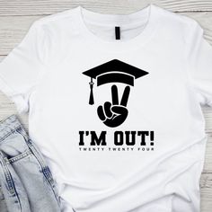 I_m Out 2024 T-Shirt, Funny Graduation Shirt, Gift For Graduation Discover Our Latest Collection Of Versatile And Stylish T-Shirts (Gildan 5000), Where Fashion Meets Ultimate Comfort! Offered In Sizes Ranging From S To 3xl And A Vibrant Spectrum Of Colors Including Black, White, Sand, Green, Sport Grey, Red, Navy, And More, There's An Option To Cater To Every Taste. Crafted With Expertise Using Premium Materials, Our T-Shirts Provide A Luxurious Sensation And An Impeccable Fit That Lasts All Day Fun Tshirts Sayings For Women Graduation, Associates Degree Graduation, Cricut Graduation, Funny Graduation Shirts, Grad Shirts, Gift For Graduation, Graduation Shirt, Graduation Funny, Graduation Shirts