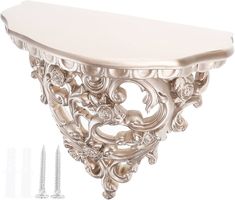 an ornately designed console table is shown with screws