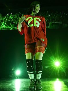 a hockey player is standing on the ice