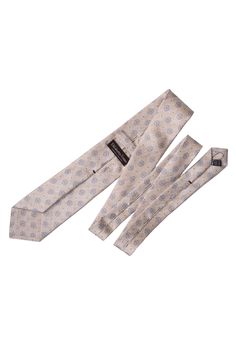 This tie is perfect for the man with a refined taste in fashion and will give your outfit a unique flair. 100% Made in Como, Italy. Extra Long Length: Approx. 3.38" x 62.5". A classic tie width and length that is perfect for most men taller than 6'2". 100% Panama Silk: Also known as basket weave is a soft, supple fabric that is resistant to wrinkles, ensuring you always look your best. 3-fold construction: This ensures your tie maintains its shape and effortlessly creates a flawless knot for a t Beige Suit And Tie Accessories For Black Tie Event, Designer Ties For Black Tie Events, Silk Ties For Business, Luxury Ties For Black Tie Events, Designer Ties For Formal Occasions, Elegant Silk Mark Certified Suit And Tie Accessories, Designer Suit And Tie Accessories For Workwear, Silk Mark Certified Ties For Business, Luxury Elegant Standard Ties