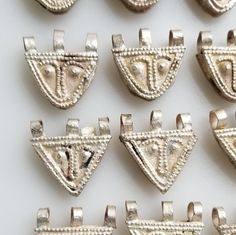 This listing is for 4 amazing Telsum metal handmade Ethiopian charms/beads. The average size is 19-20 MM wide by 18-20 MM long including bail.  Due to the handmade nature of these charms some imperfections are to be expected (notice the dark spots and other blemishes). Item#S1940 You will get 4 charms similar to the ones shown in pictures. I usually ship two from each shape. The price is for 4 charms. Traditional Sterling Silver Jewelry With Spacer Beads, Traditional Silver Jewelry With Charms, Artisan Silver Jewelry With Spacer Beads, Traditional Silver Jewelry With Spacer Beads, Silver Pendant Jewelry With Spacer Beads, Silver Amulet Jewelry With Round Beads, Ethiopian Jewelry, Amulet Charm, Prayer Box