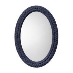 an oval mirror with braided rope around the edges, on a white wall background