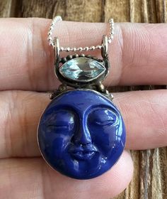 "Lapis Lazuli and Blue Topaz Sterling Silver Pendant 1-5/16\" L by 13/16\" W Carved Lapis gem is 19x19mm. Blue Topaz is 11x5mm. 4.4g Sterling Silver, stamped 925. *Hand carved Lapis gem has a detailed face design and is accented by a marquise Blue Topaz. Pendant is oxidized and has a vintage vibe. 18\" Ball Chain is optional and is 1mm wide, Sterling Silver and 2g. *Please check out my Etsy store for more one of a kind, handmade pieces that feature genuine gemstones and Sterling Silver. I love t Goddess Face, Lapis Lazuli Blue, Portraits Art, Gem Mining, Face Gems, Animal Portraits, Blue Topaz Pendant, Topaz Pendant, Money Aesthetic