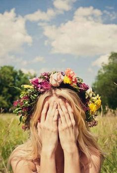 a woman covering her face with her hands and the words happy may in front of her