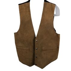 This vintage biker vest is crafted from genuine leather and features a sturdy snap button front closure. The brown color and solid pattern give it a timeless appeal, while the polyester lining ensures comfort. With multiple pockets, it's a practical addition to any wardrobe. The vest comes in XL size and is from the 'Easy Rider' model of the 'Made & Crafted' product line. The accents include buttons, and the outer shell material is leather. The closure is snap, and the vest has a variety of features, including pockets. This men's vest is perfect for those who want to add a touch of rugged style to their wardrobe. Rugged Leather Vest Outerwear, Rugged Brown Vest Outerwear, Rugged Fitted Vest Outerwear, Outdoor Leather Vest With Pockets, Fall Biker Vest For Outdoor, Fall Outdoor Biker Vest, Brown Rugged Vest For Winter, Rugged Brown Winter Vest, Brown Rugged Winter Vest