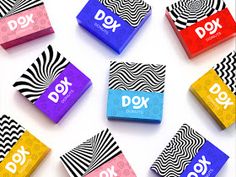 six different colored candy bars sitting next to each other on a white surface with the word dox printed on them