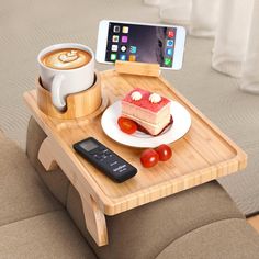 there is a tray with food on it and a cell phone sitting on the table