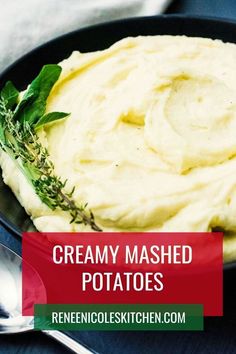 creamy mashed potatoes in a black bowl with herbs on top and the words, creamy mashed potatoes