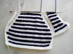 two crocheted dishcloths hanging on a hook