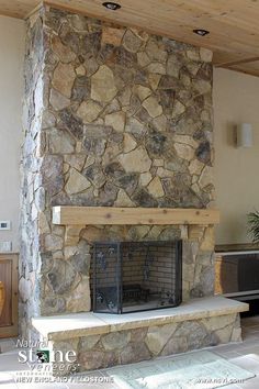 a large stone fireplace in a living room