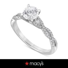 a white gold engagement ring with diamonds on it