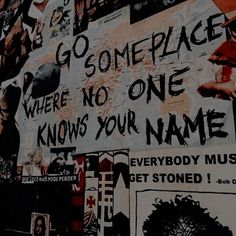 there is a sign on the wall that says go someplace, where no one knows your name