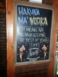 a sign on the wall that says hakuna ma vodka it means no memories for the rest of your day