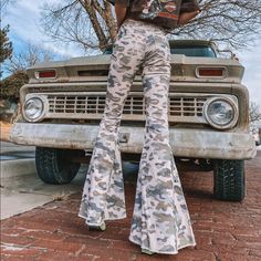 Tan Colored Corduroy Pants With Light; Olive Green, Blue, Navy And Brown Camouflage Pattern All Over. High Waisted With Frayed Bottom Hem. These Pants Look Adorable Paired With A Vintage Harley Davidson Tee From Our Vintage Section And A Pair Of Boots! 97% Cotton & 3% Spandex Model Is Size Small Wearing Size Small Measurements: S: Waist 26" - Hip 34" - Thighs 19" - Rise 10.5" - Inseam 32" - Length 43" M: Waist 28" - Hip 37" - Thighs 20" - Rise 11" - Inseam 32" - Length 43" L: Waist 30" - Hip 39" Fitted Camouflage Cargo Pants, Fitted Full Length Camouflage Pants, Fitted Camouflage Bottoms For Fall, High Rise Khaki Bottoms For Fall, Cotton Camouflage Bottoms For Fall, Camouflage Cotton Bottoms For Fall, Fall Camouflage Cotton Bottoms, Stretch Khaki Bottoms For Fall, Fall Camouflage Cargo Jeans