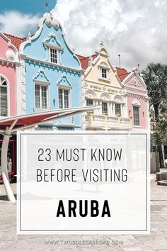 colorful buildings with text overlay that reads 23 must know before visiting arubaa