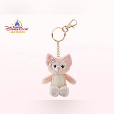 a pink teddy bear keychain hanging from a chain