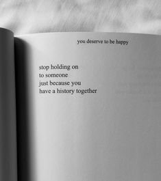 an open book with the words stop holding on to someone just because you have a history together