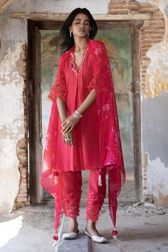 Peony pink kurta with dori, pearl, sequin embroidered neckline and sleeve hem. Paired with flared pant and bagh print dupatta.
Components: 3
Pattern: Printed, Embroidery
Type Of Work: Bagh, dori, pearl, sequin
Neckline: Scallop V neck
Sleeve Type: Three quarter
Fabric: Soft Organza, Net, Crepe
Color: Pink
Other Details: 
Embroidery on pant hem
Sheer printed dupatta
Scallop border
Occasion: Sangeet - Aza Fashions Elegant Pink Embroidered Dupatta, Designer Pink Sets For Festivals, Elegant Pink Dupatta, Designer Embroidered Pink Sets, Designer Pink Embroidered Sets, Designer Dupatta For Festivals, Elegant Summer Set With Gota Work, Elegant Summer Sets With Gota Work, Designer Dupatta For Festive Occasions