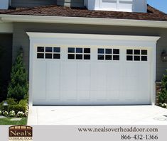 a white garage door with windows on the side