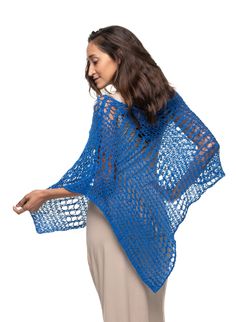 The Knitted Asymmetrical Poncho Big Hole is a versatile piece to have in your wardrobe. It is one piece cut on an angle and covers one side of the body. It is a old vintage fish netting design with an updated twist. This style can be worn dressy or casual and pairs well with dresses, skirts or almost anything. It is made of a super soft big hole single knit. It is loose but still lays snuggly on the body with its see through silhouette. It is a one size fits most garment. Available in a beautifu Beach Open Knit Poncho One Size, Beach Poncho In Open Knit One Size, Beach Poncho With Open Knit One Size, One Size Blue Shawl For Beach, Open Knit Poncho For Beach, One Size Shawl Cape For Beach, Blue One-size Poncho For Vacation, Blue Shawl Poncho For The Beach, Blue Shawl Poncho For Beach