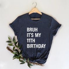 Celebrate your 11-year-old's big day in style with our "Bruh It's My 11th Birthday" T-Shirt. This Custom Birthday Shirt is the perfect way to showcase their unique personality. With its touch of humor and sarcasm, it's sure to be a hit at the Birthday Party. Make the birthday boy feel extra special with this Funny Birthday Gift that's designed for laughter and fun. It's not just a shirt; it's a one-of-a-kind Happy Birthday Custom Shirt that they'll cherish. HOW TO ORDER Step 1) Please, check and review all photos. Step 2) Choose your outfit size and color. ➖Different styles of shirts may have different shades of the same color choice due to different manufacturer brands. Step 3) Read the instructions carefully. Enter your Design Font Color and if applicable Design name. ➖ For Example, Emma Casual Birthday Slogan Shirt, Birthday Gift Letter Print Crew Neck Shirt, Fun Letter Print Shirt For Birthday Gift, Birthday Gift Crew Neck Shirt With Letter Print, Crew Neck Shirt With Letter Print For Birthday, Funny Crew Neck Shirt For Birthday, Birthday Letter Print Graphic Tee, Birthday Letter Print Graphic Tee Shirt, Funny Birthday Shirt With Letter Print