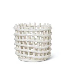 a white basket is shown on a white background